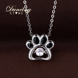 DANCING STONE STERLING SILVER DOG PAW PENDANT.